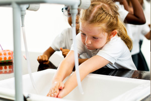 school pupils washing hands